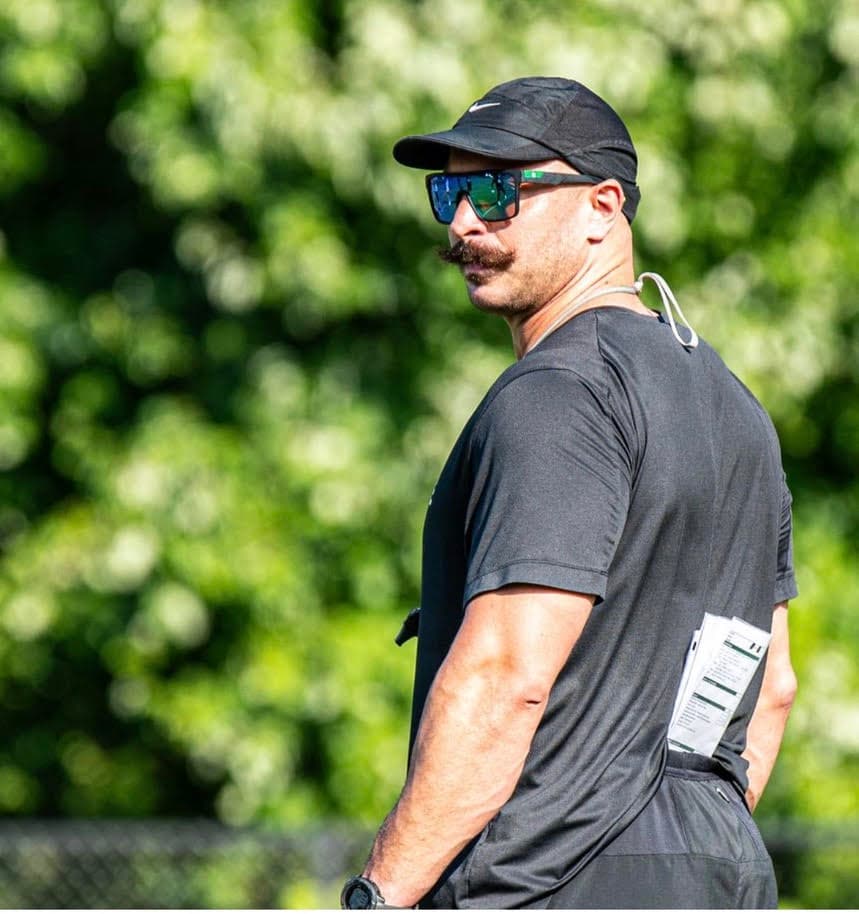 Brian coaching at an outdoor football practice