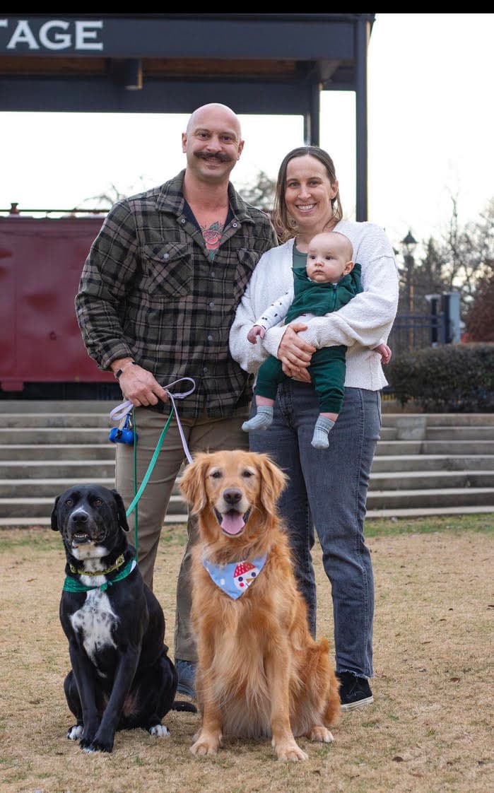 Brian with his family and their two dogs